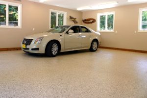 Car parked on a newly concrete coated garage floor.