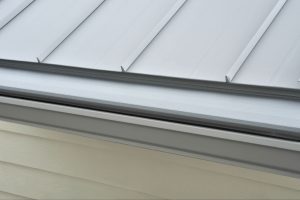 Gutter guard on Metal Roof.