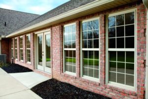 Row of Double-Hung Windows on a Brick Home