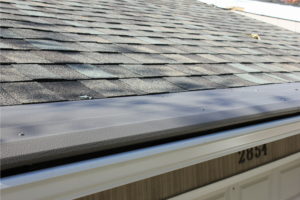 Close-up view of a roof with gutters